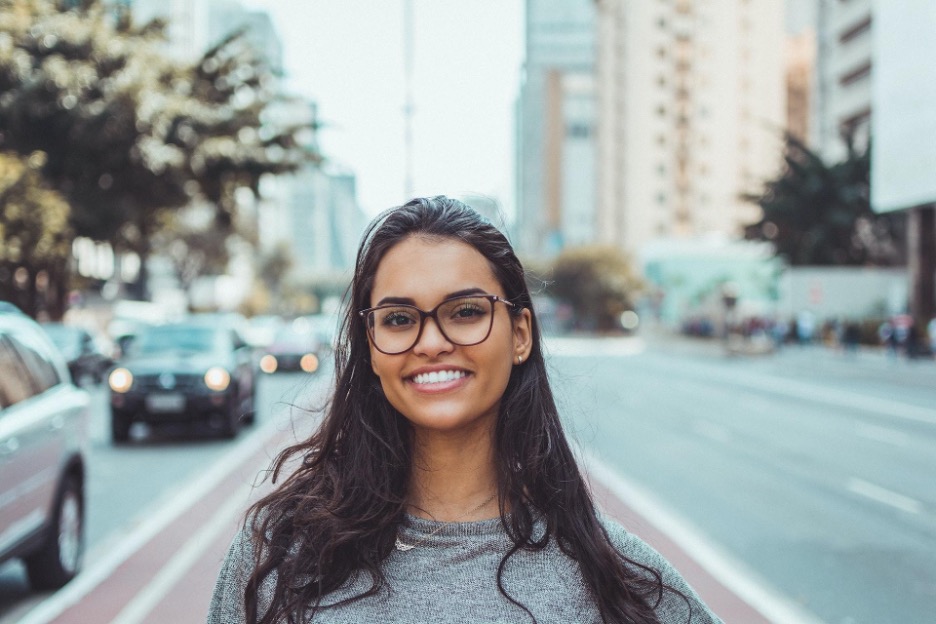A girl with glasses smiling