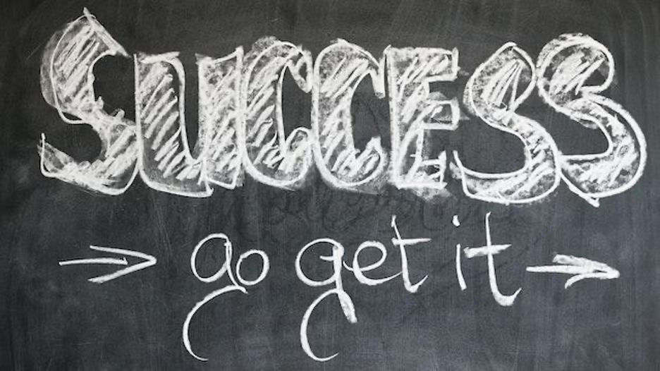 Success, go get it, written on a blackboard.