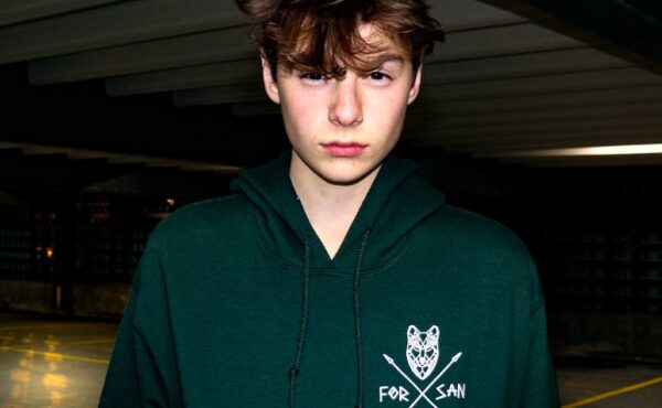 A teen boy in a sweatshirt